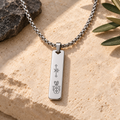 Men's necklace with Strength and Wealth symbols stacked, front view