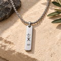 Men's silver necklace with Happiness symbol and Kaler Adali mantra, front view